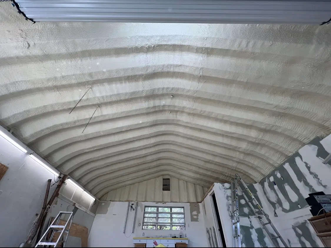 Spray polyurethane foam applied to the underside of a metal roof deck in Tukwila